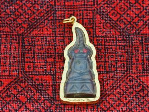 One of the most popular spirits in Thailand and the inspiration behind this site, Phra Ngang Taa Daen is the naughty "Underworld Buddha" believed to assist in matters of attraction, luck and protection.